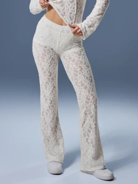 Tejes árnyalatú, bővülő szárú leggings puha, texturált csipkéből